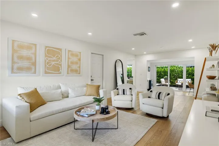 Living room with light hardwood / wood-style flooring