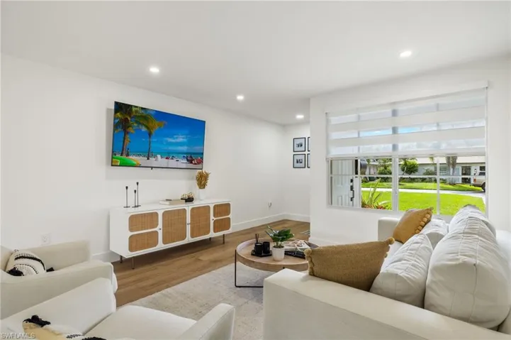 Living room with light hardwood / wood-style floors