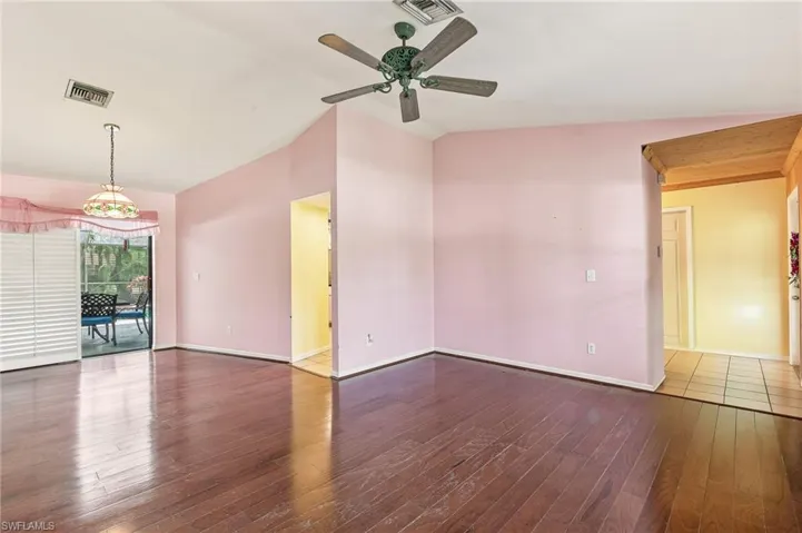 Combined Dining and Front Living Room, wood floors, vaulted ceiling.
