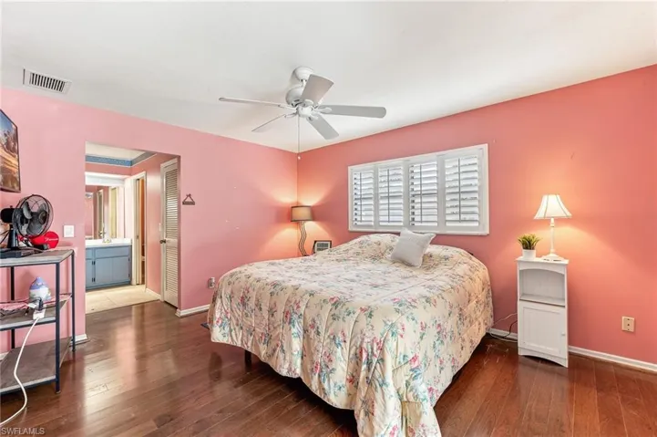 Bedroom featuring rich wood-finish flooring and a ceiling fan