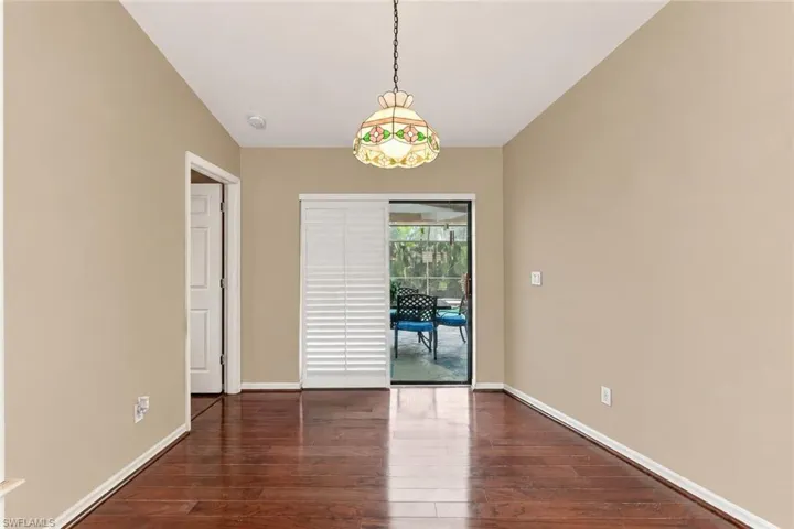 Virtual Paint on Walls.  Wood Floor, Light Fixture, Lanai Access.