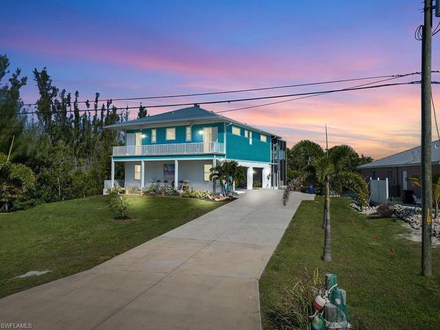 Expansive front porch with fans on balcony