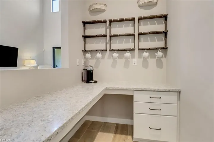 coffee or bar nook with wine refrigerator & Nespresso machine