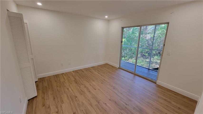 Guest bedroom 2 with access to screened patio