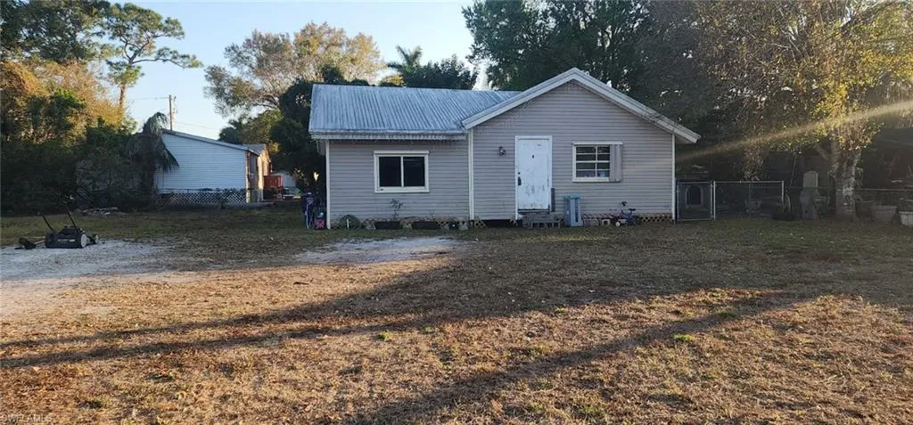 View of front of house with a metal roof