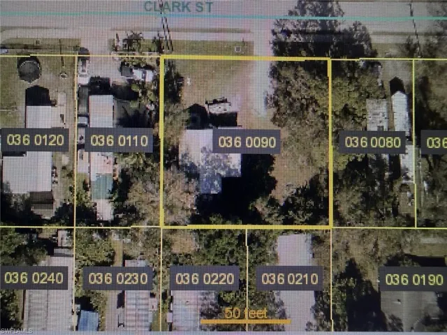 Aerial map of property and surrounding area featuring property parcel outlined