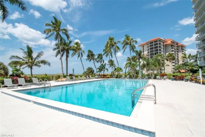 Community pool featuring a patio