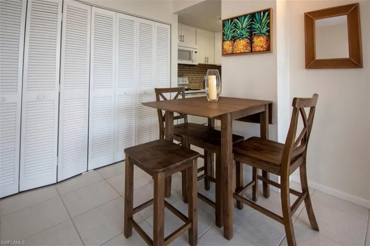 Dining area featuring light tile patterned floors