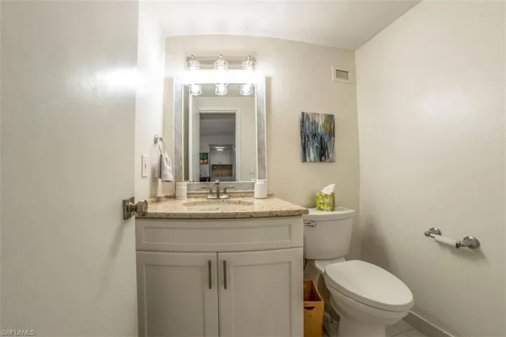 Half bath with vanity and toilet