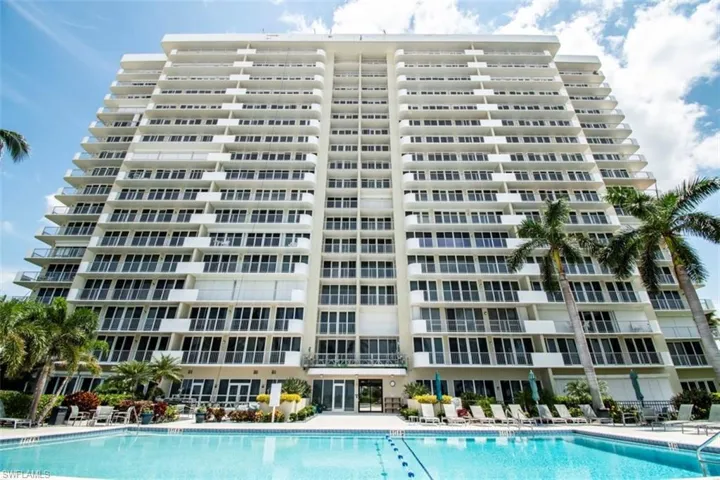 Community pool with a patio