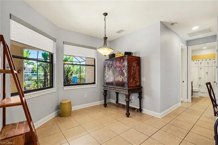 Dining room with baseboards and light tile patterned floors