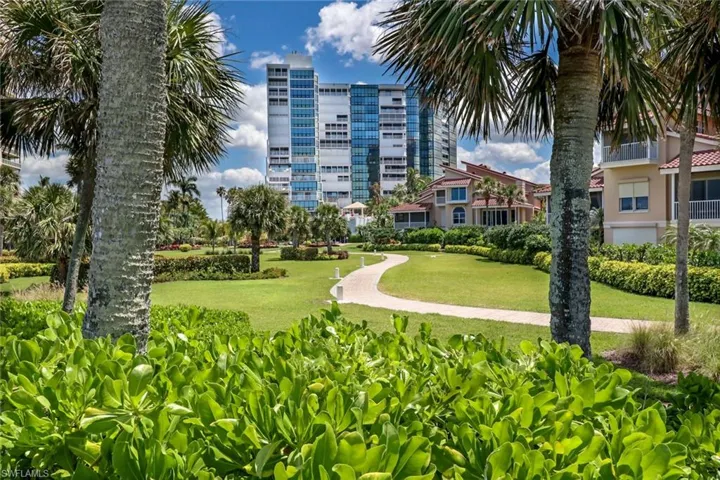 View of property's community featuring a lawn