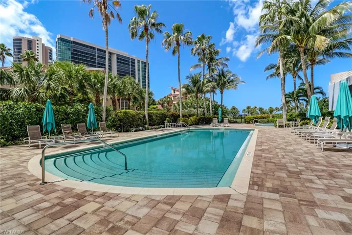 Community pool featuring a patio