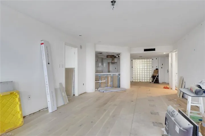 Unfurnished living room with wood finished floors