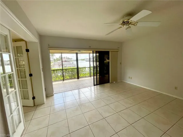 Open & bright with water views with French Doors to DEN.