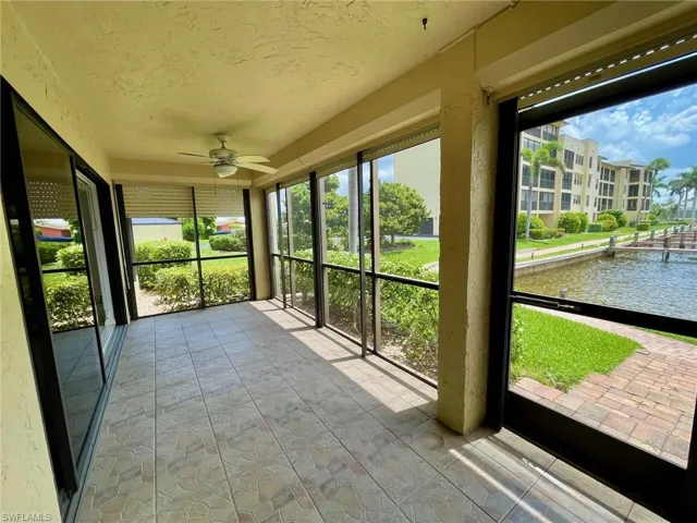 Pretty DEN with French doors, lots of windows & beautiful water views.