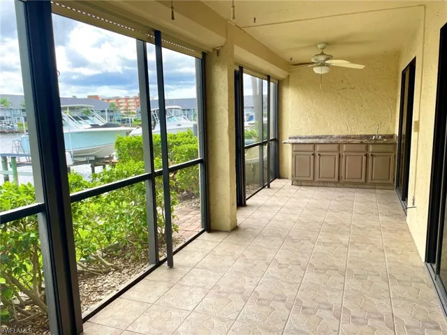 Pretty DEN with French doors, lots of windows & beautiful water views.