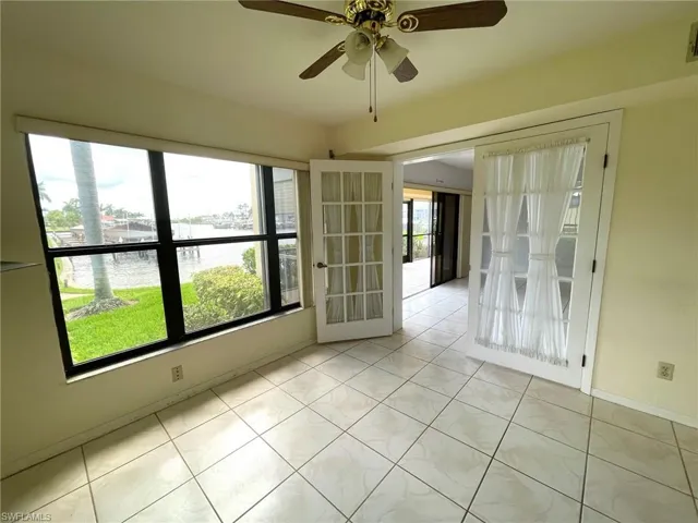Den has French doors & plenty of windows which make a end unit even better!