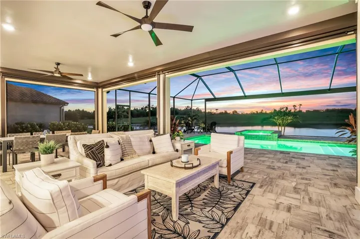 Patio terrace at dusk featuring ceiling fan