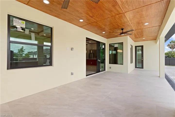 View of patio featuring ceiling fan