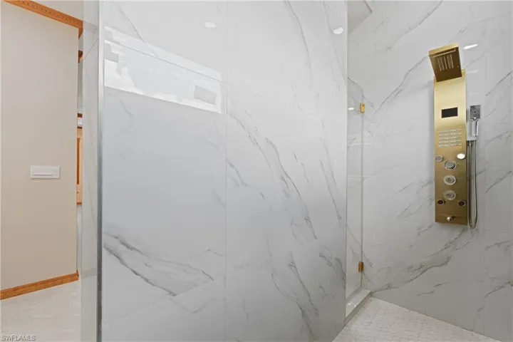 Bathroom with a tile shower