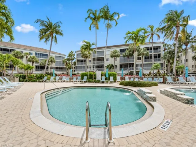 Pool featuring a patio area and fence