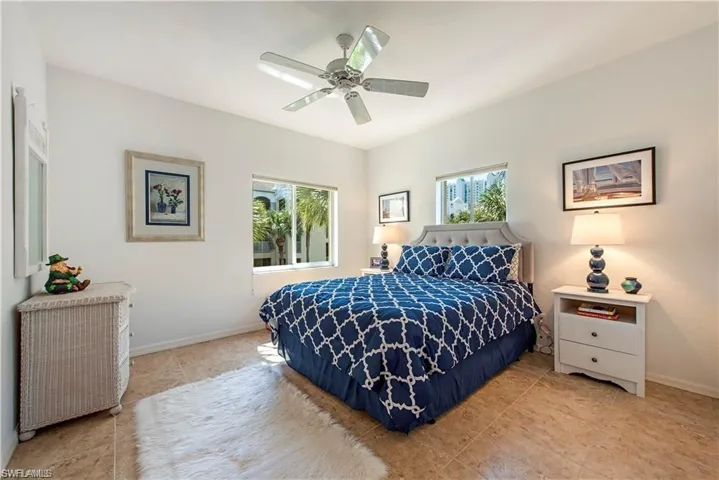 Bedroom with baseboards and a ceiling fan