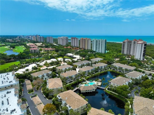 Drone / aerial view with a view of city and a water view
