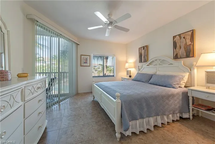 Bedroom featuring a ceiling fan and access to outside