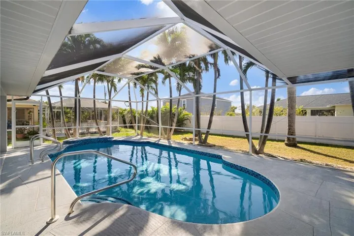 View of swimming pool with a lanai, a patio area, a fenced backyard, and a fenced in pool