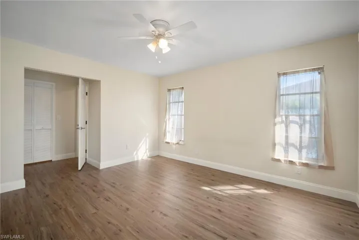 Empty room with wood finished floors and baseboards