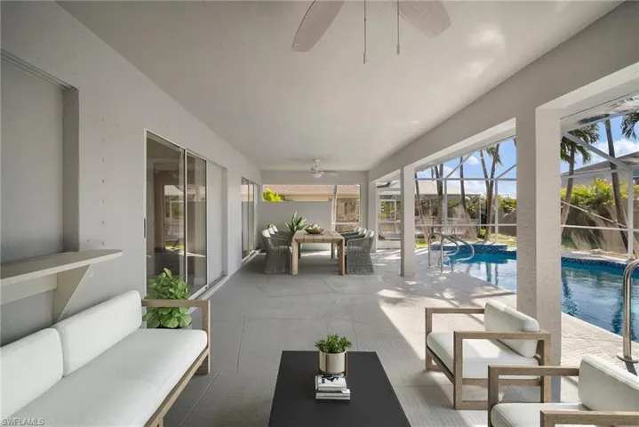 Sunroom featuring ceiling fan