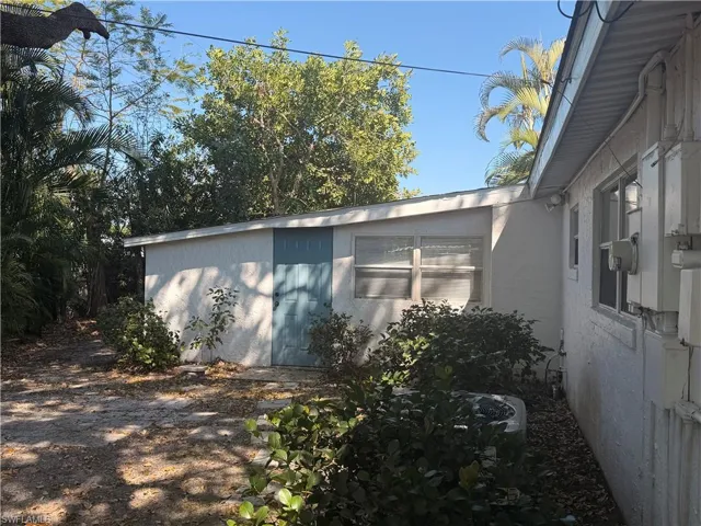 View of side of property featuring stucco siding