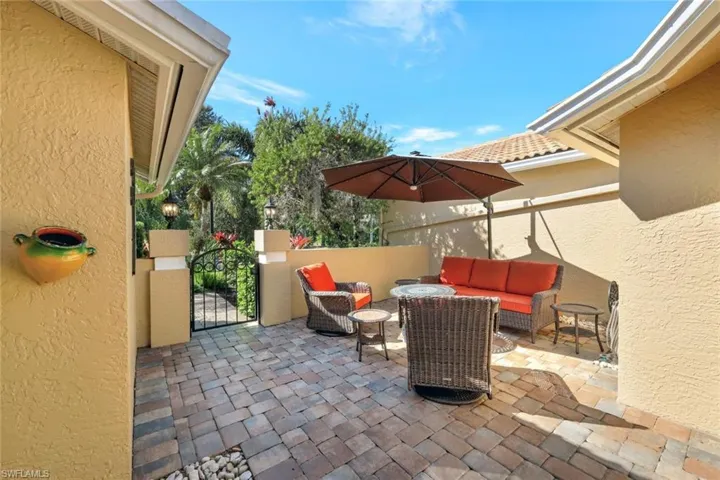 View of patio with an outdoor hangout area