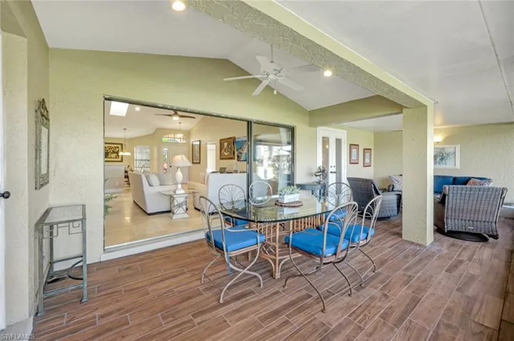 Dining space with lofted ceiling and ceiling fan