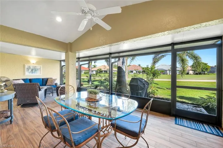 Sunroom with vaulted ceiling and ceiling fan