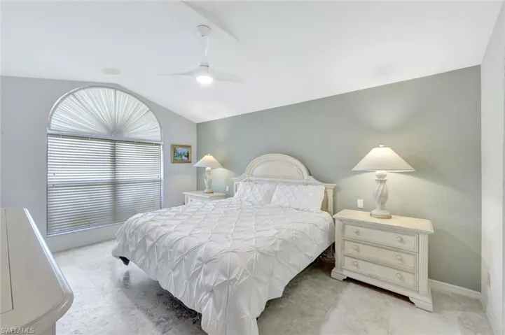 Bedroom featuring vaulted ceiling and ceiling fan