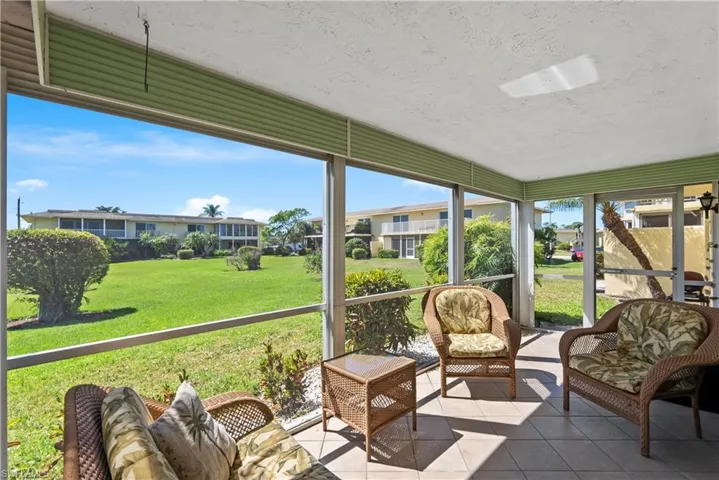 Screened lanai overlooking expansive courtyard.