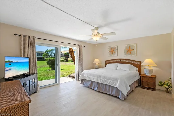 Primary bedroom featuring access to exterior patio.
