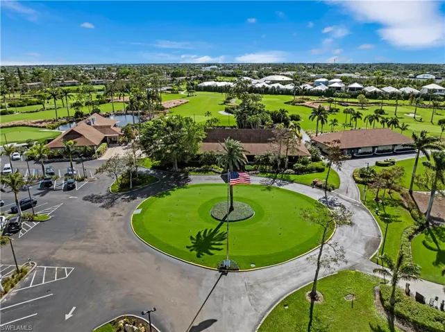 Aerial view featuring a the clubhouse and 19th hole restaurant.