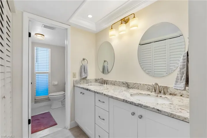 Bathroom with double vanity and sinks.