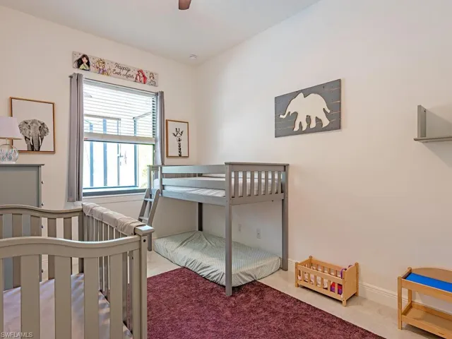 Bedroom featuring carpet and ceiling fan