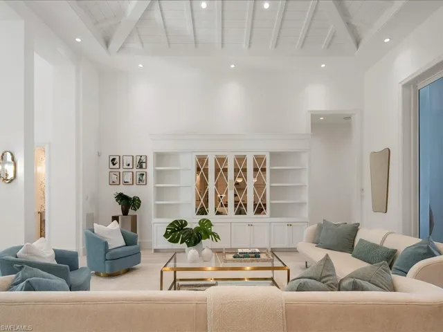 Living room featuring high vaulted ceiling, beam ceiling, wood ceiling, light wood finished floors, and recessed lighting