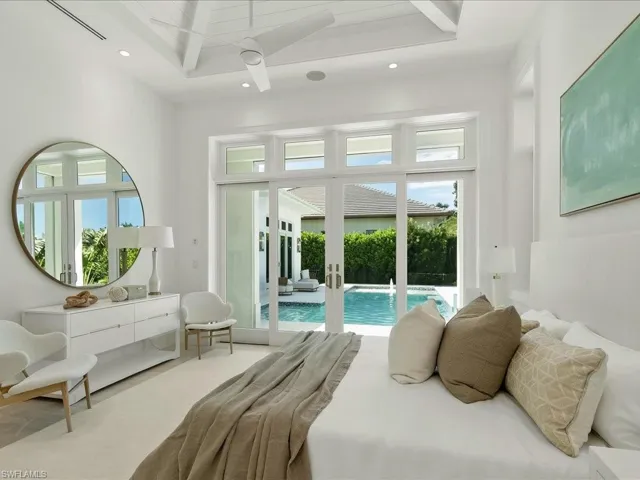 Carpeted bedroom with access to outside, french doors, recessed lighting, and beam ceiling