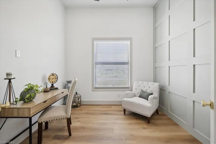 Office area with light hardwood / wood-style flooring