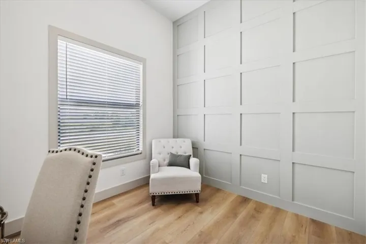 Sitting room with light hardwood / wood-style floors