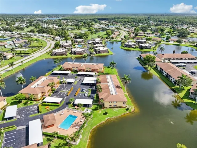Aerial perspective of suburban area with a large body of water