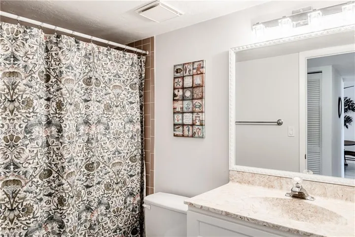 Bathroom with vanity and a shower with curtain