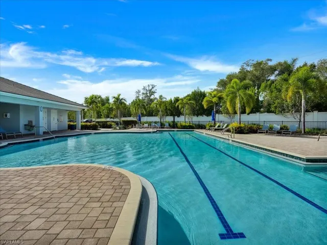 Community pool featuring a patio
