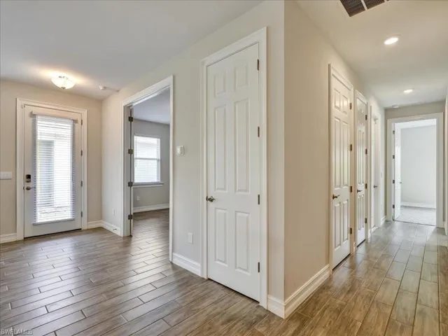 Entryway featuring wood finish floors and baseboards